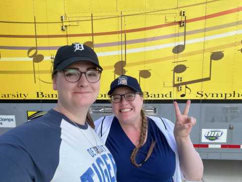 Standing in front of the Plymouth-Canton Marching Band trailer in September 2025. We survived!